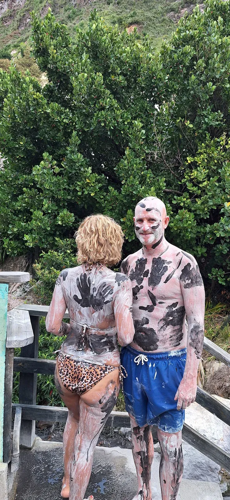 Couple enjoying the volcanic mud bath at Sulphur Springs, Soufriere, St. Lucia